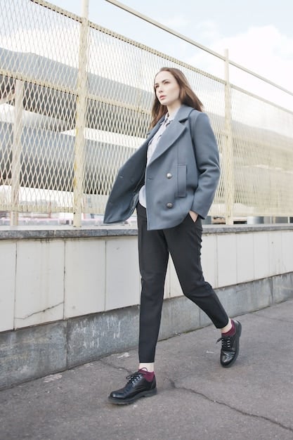 A pair of stylish sneakers paired with tailored trousers and a knitted sweater, showcasing the trendy yet comfortable aspect of Korean drama fashion.